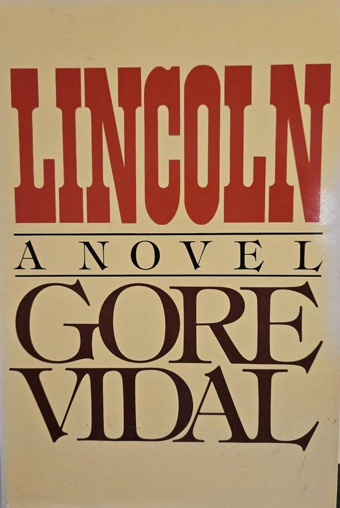 May include: First edition hardcover book.  The cover is beige with red and brown text. The title 'LINCOLN' is in large, bold, red serif font. Below it, 'A NOVEL' is written in a smaller, serif font. The author's name, 'GORE VIDAL', is displayed prominently in a dark brown serif font.