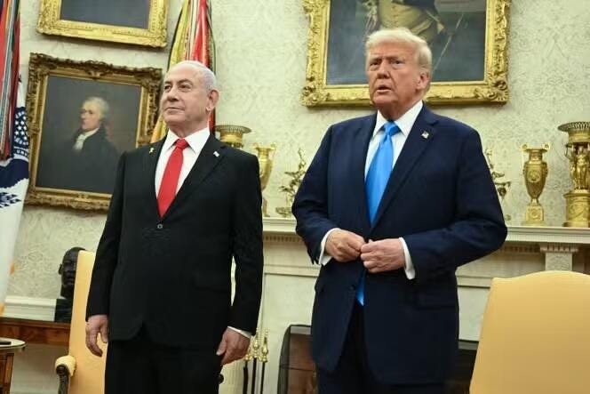 Two men in suits in a room

Description automatically generated