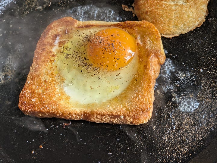 Cooking one eyed toast.