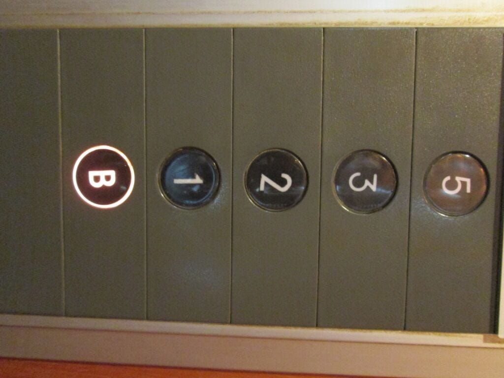 Elevator with missing 4th floor button. Elevator with missing 4th floor button.