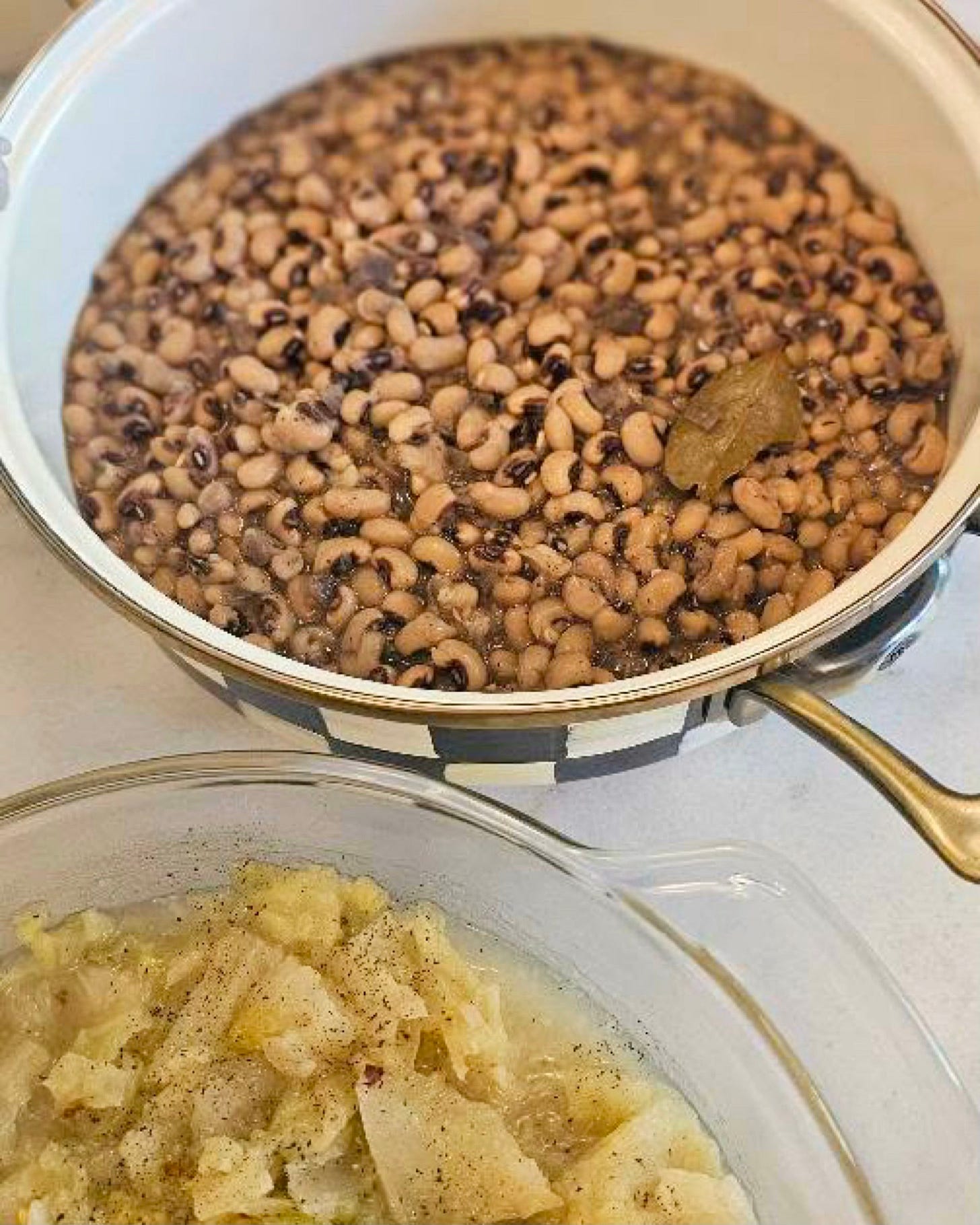 Black-eyed peas cooking on the stovetop, a traditional soul food dish symbolizing cultural heritage and New Year’s food traditions in Black communities