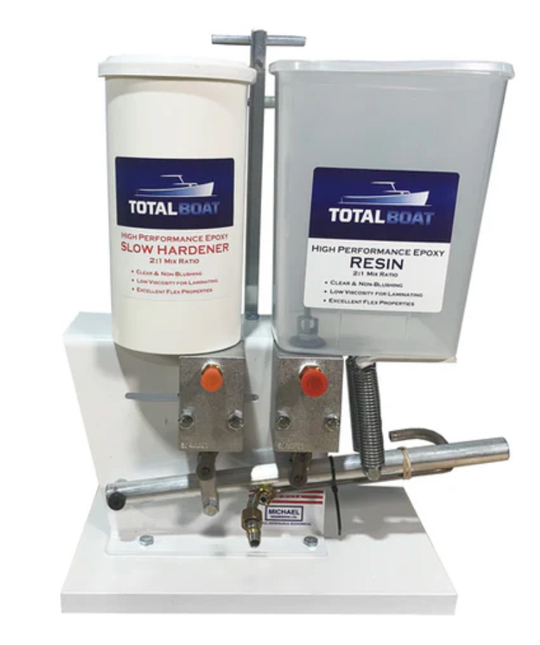 A white and grey plastic container with red buttons

AI-generated content may be incorrect.