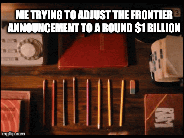 "Me trying to adjust the Frontier announcement to a round $1 billion" above a photo of pencils lined up precisely on a wooden desk.