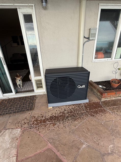 The images are of the back of a house with two fairly prominent black heat pumps, and electrical conduits sneaking across all of the walls.