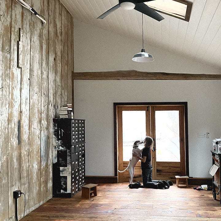 An image of Pearl and Soren in the new barn and an image of the saw mill used to make doors out of an American Chestnut tree.