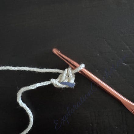 A crochet hook with a string

Description automatically generated