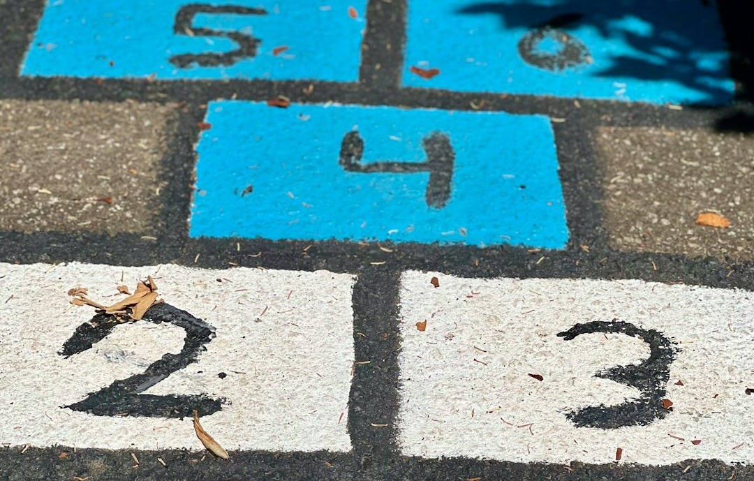 a street sign with a number on it a street sign with a number on it