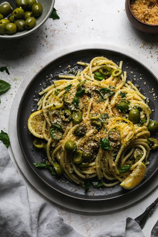 Overhead shot of pasta on a dark plate