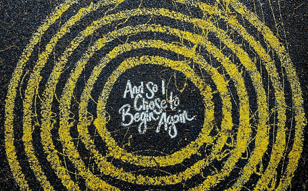 yellow and black round logo