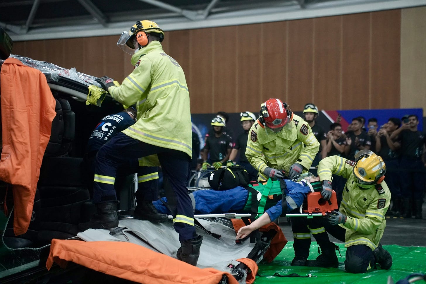 Lifesavers evacuate a victim in a car accident scenario during the Singapore-Global Firefighters & Paramedics Challenge (SGFPC) 2025 Lifesavers evacuate a victim in a car accident scenario during the Singapore-Global Firefighters & Paramedics Challenge (SGFPC) 2025