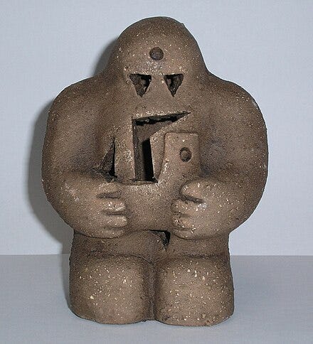 a reproduction of the Prague golem, a clay model ready to be animated by a sorcerer a reproduction of the Prague golem, a clay model ready to be animated by a sorcerer