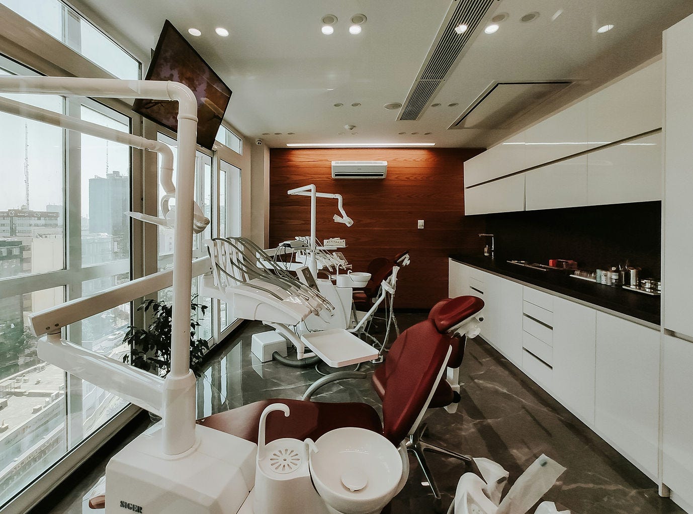 An interior of an aesthetic clinic with multiple aesthetic machines and devices An interior of an aesthetic clinic with multiple aesthetic machines and devices