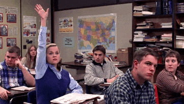 GIF from Election (1999): Reese Witherspoon, playing Tracy Flick, shoots her hand into the air in a classroom full of disinterested students, eagerly demanding to be picked.
