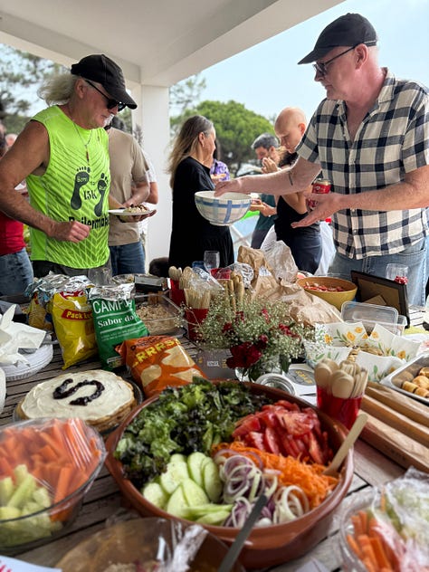 people outside having a party, playing live music and a swimming pool and bbq