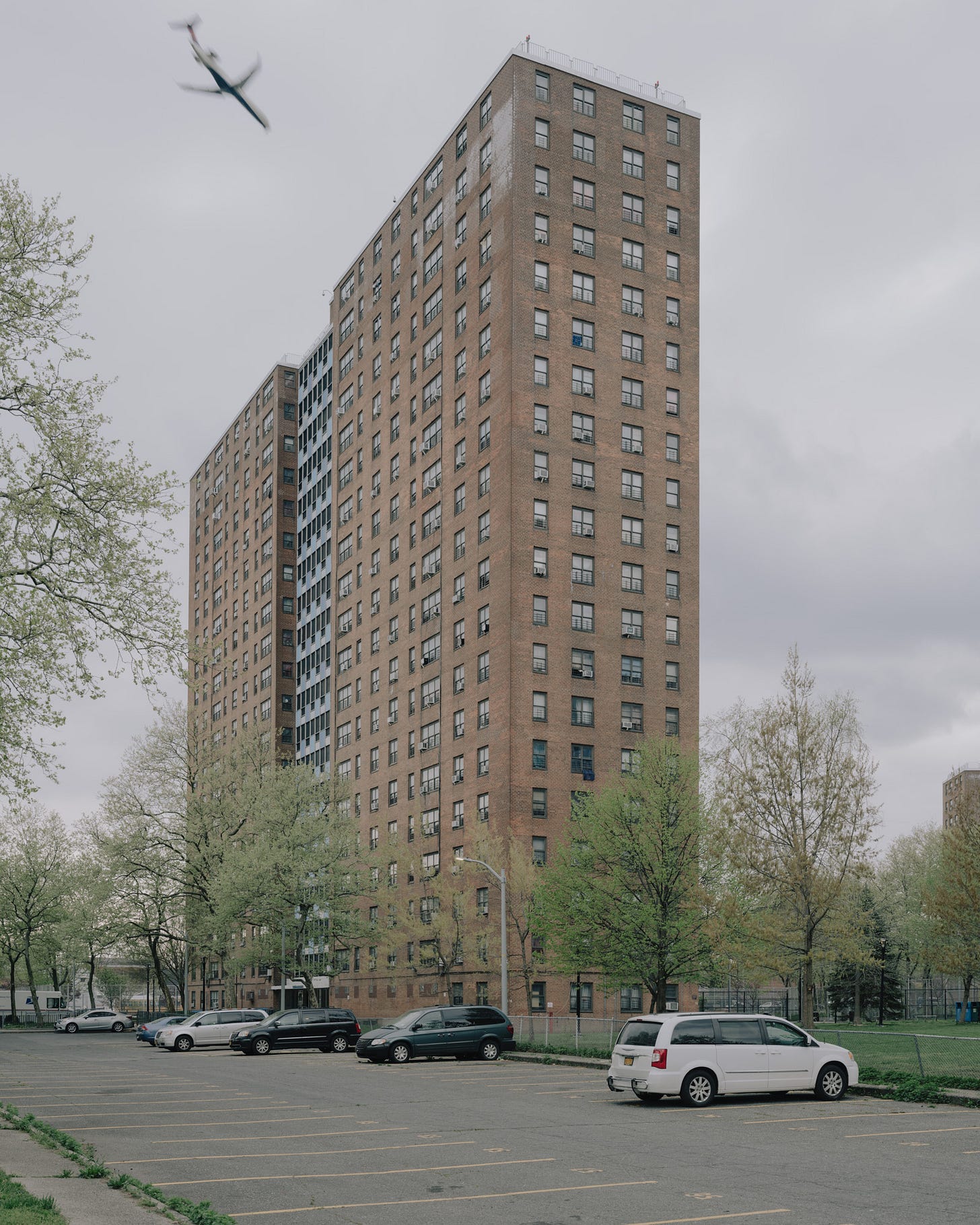 Castle-Hill-Housing-Projects-Building-with-airplane-above