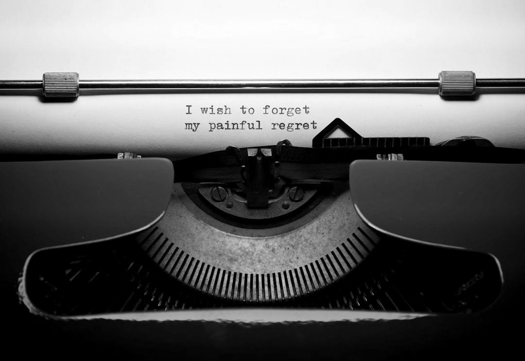 a close up of a typewriter with the words i wish to forget a close up of a typewriter with the words i wish to forget