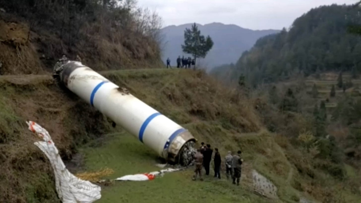 One of the Long March 3B/E’s boosters on the ground, after being guided by a parachutes, in March 2020. One of the Long March 3B/E’s boosters on the ground, after being guided by a parachutes, in March 2020.