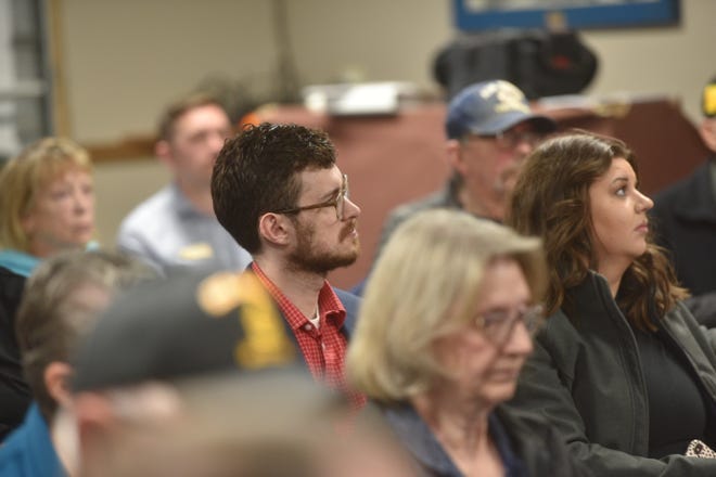 Dezmond Ward, a member of Sen. Mike Rounds staff, listens to a veteran speak during the South Dakota Veterans Council's quarterly meeting Wednesday at the Military Heritage Alliance in Sioux Falls.