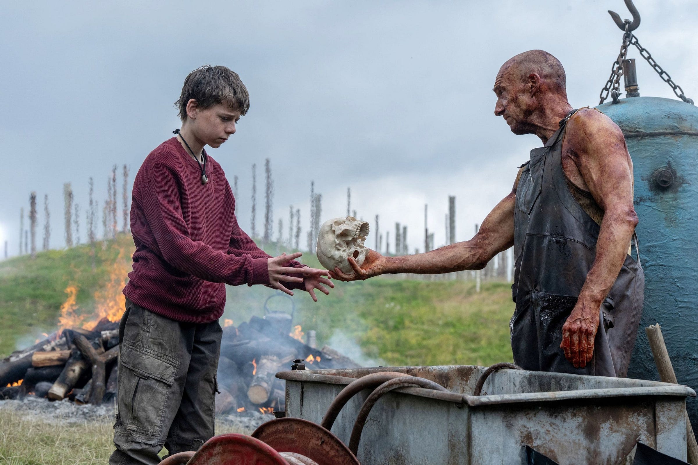 Dr. Kelson handing Spike a skull