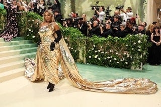 Image may contain Serena Williams Clothing Glove Footwear High Heel Shoe Adult Person Formal Wear and Camera