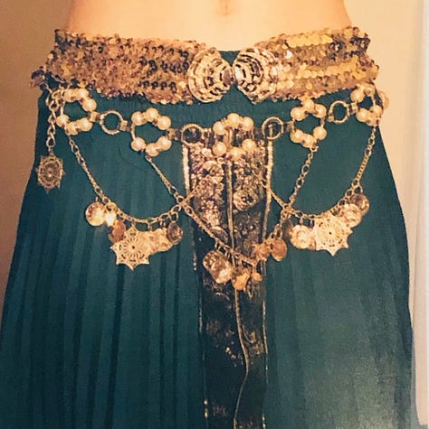 The author in a variety of belly dance costumes from her restaurant days.