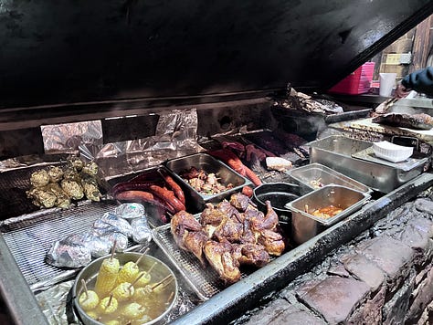 Hard Eight sign, grill, and trays with food