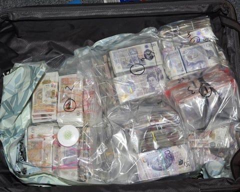 A National Crime Agency photo of money found in suitcases at Heathrow. A National Crime Agency photo of money found in suitcases at Heathrow.