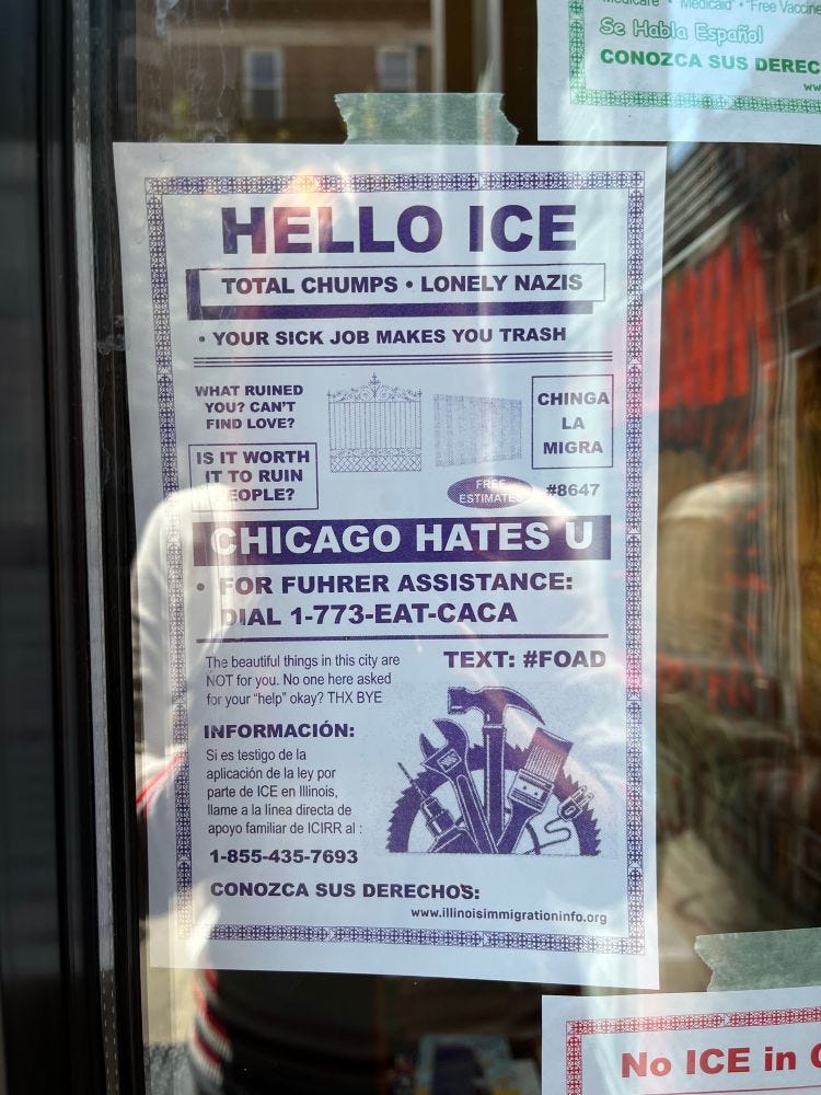 An anti-ICE flyer hanging in the window of the bookstore.