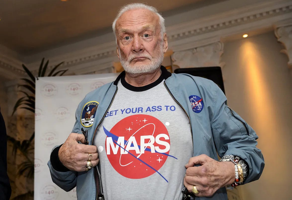 Buzz Aldrin sporting a t-shirt promoting exploration of Mars, 12 November 2015 in Geneva. Credit: FABRICE COFFRINI/AFP via Getty Images