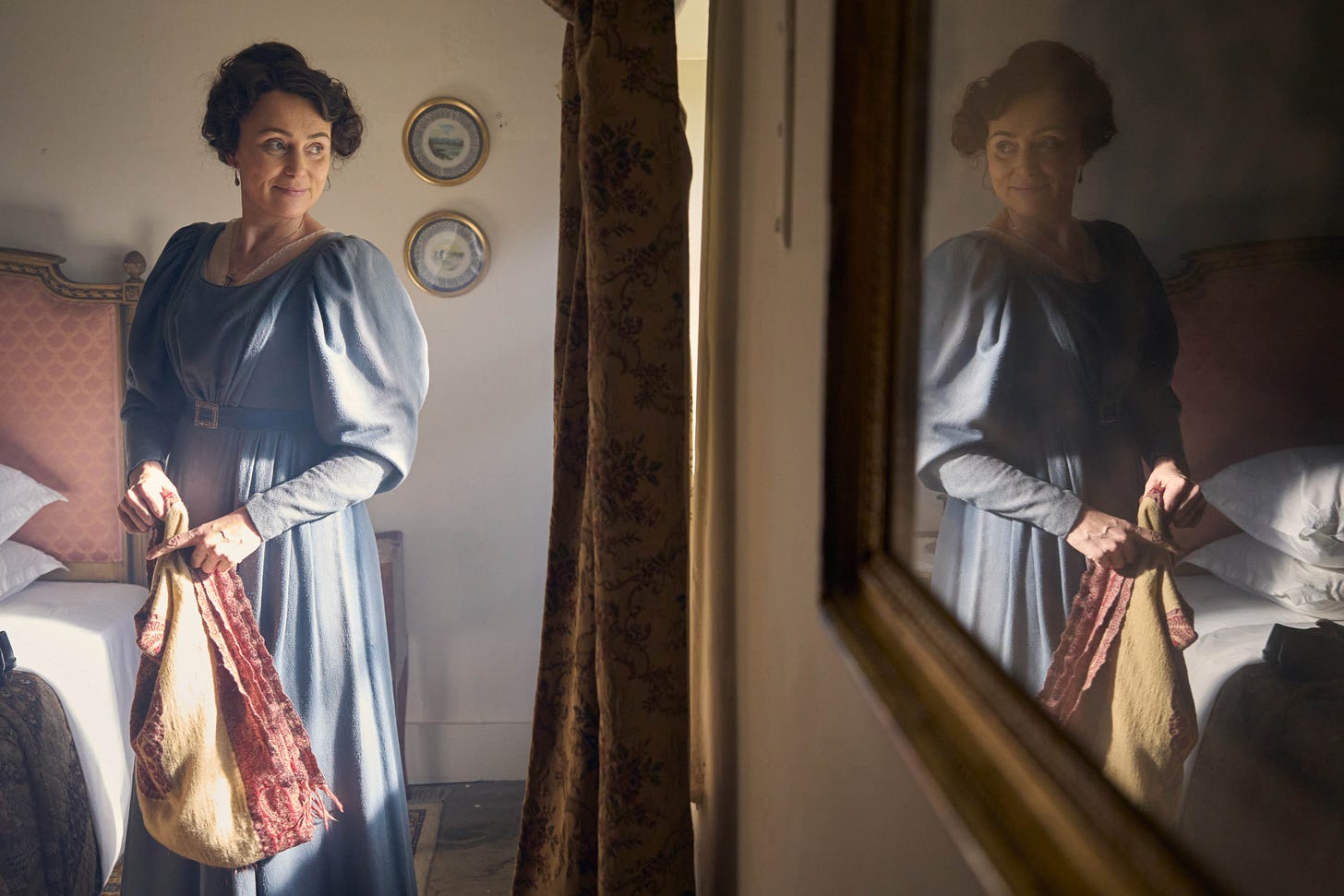 From a PBS Masterpiece set photo, the actor Keeley Hawes is in a plain Regency frock, holding sewing in her hand, and gazing out of a window, with her reflection showing in the glass. From a PBS Masterpiece set photo, the actor Keeley Hawes is in a plain Regency frock, holding sewing in her hand, and gazing out of a window, with her reflection showing in the glass.
