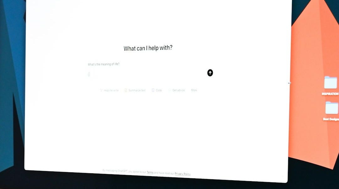 A computer monitor sitting on top of a desk