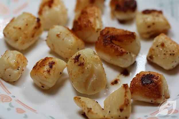 Heat the skillet over medium-high to high heat until it’s hot; add 1 tablespoon Roasted Garlic Grapeseed Oil and heat until the oil begins to shimmer. Place the scallops in the pan with 1 tablespoon of butter, leaving enough space so they don’t steam each other. Work in batches if necessary.