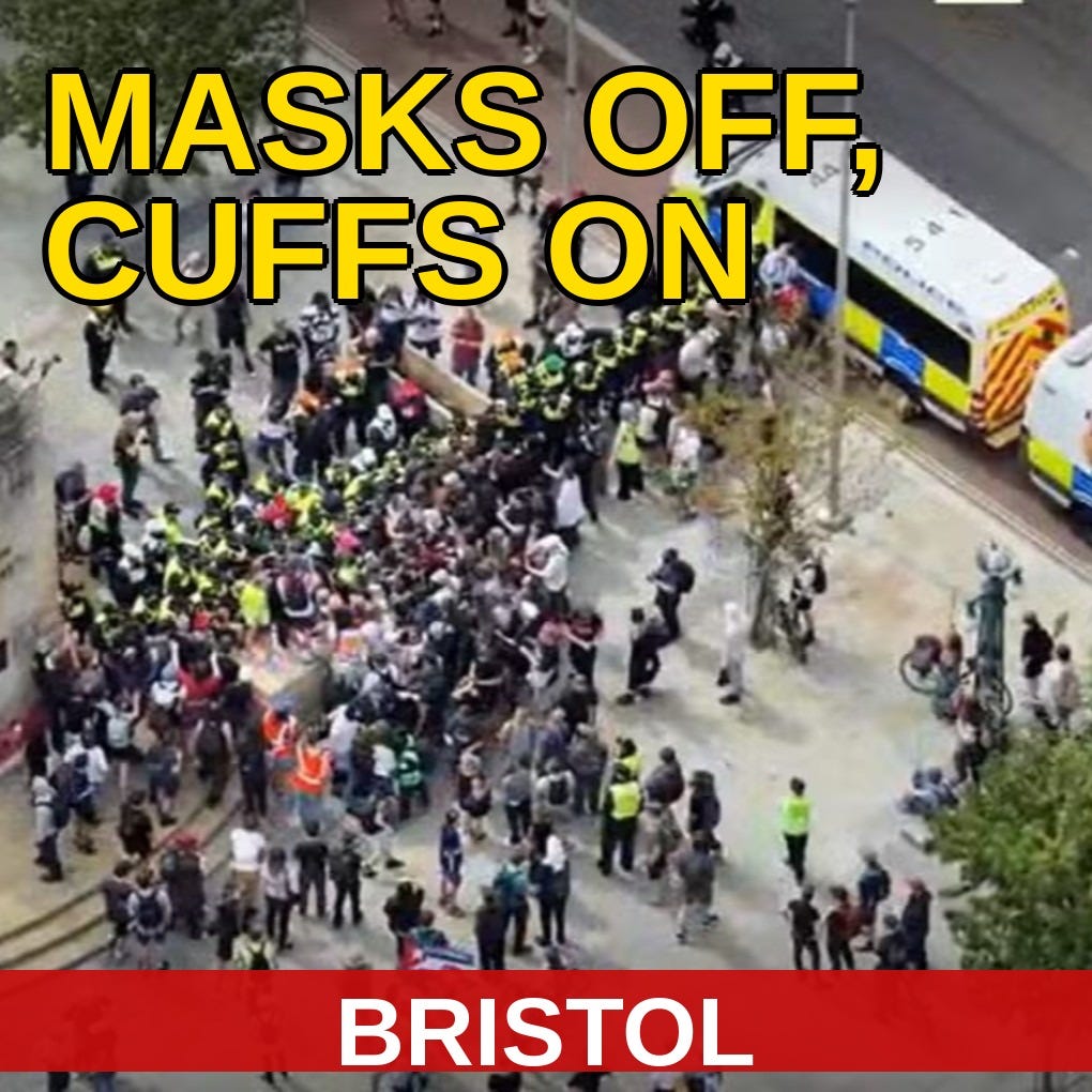 Aerial view of police officers in high-vis forming a line between protesters and counter-protesters at Bristol's Cenotaph war memorial, with police vans stationed on the road nearby, 8 August 2026. www.thealmightygob.com Aerial view of police officers in high-vis forming a line between protesters and counter-protesters at Bristol's Cenotaph war memorial, with police vans stationed on the road nearby, 8 August 2026. www.thealmightygob.com