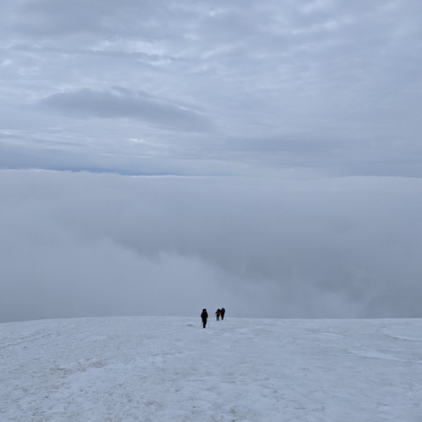 distant figures walking in the snow