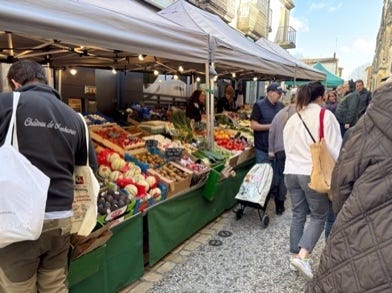 People walking around a market