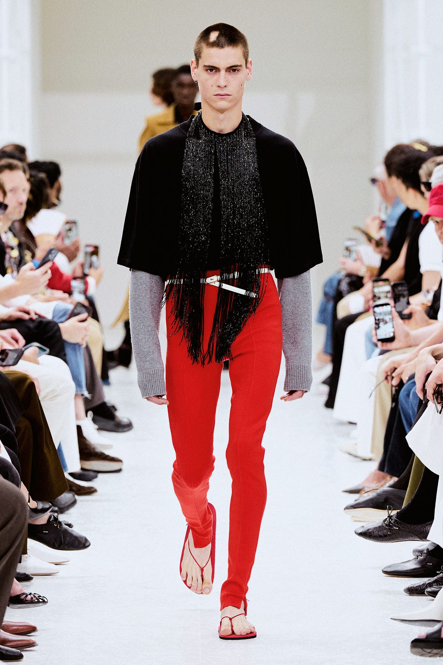 Image may contain Clothing Pants Fashion Adult Person Coat Cape Electronics Mobile Phone and Phone Image may contain Clothing Pants Fashion Adult Person Coat Cape Electronics Mobile Phone and Phone