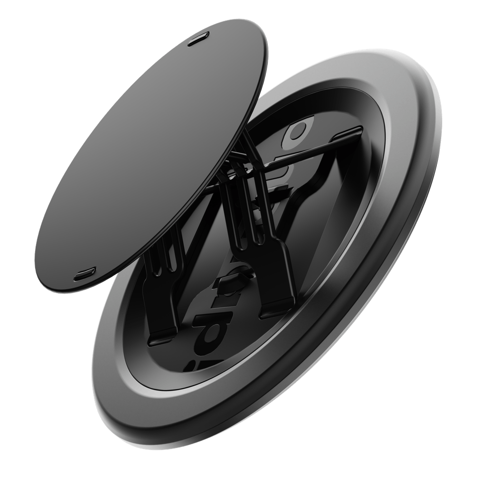 Black circular grip accessory with a removable top and adjustable support arms.