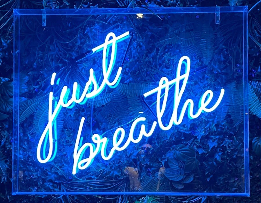 a sign with blue lights a sign with blue lights