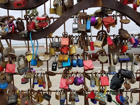 Heart sculpture in Oceanside, California with 3 pictures, one showing a close up of the locks, one of the sculpture with many locks and one with just a few locks when the sculpture was first installed.
