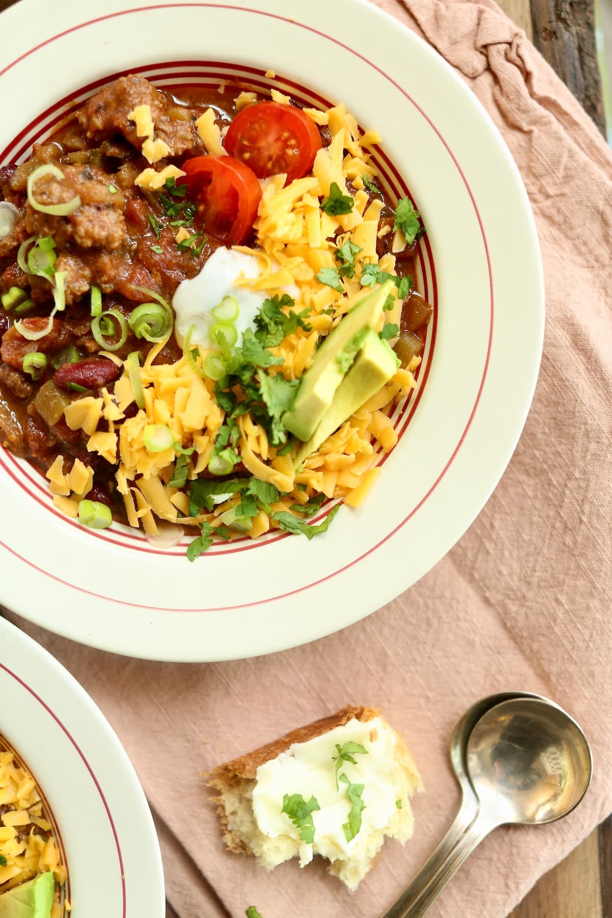 an overhead side photo of a bowl of beef chili, made with Guinness stout.