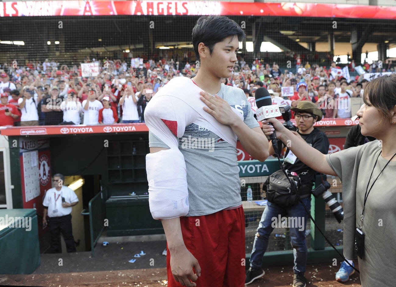 Los Angeles Angels Shohei Ohtani comes out of the clubhouse with his arm iced, for an interview with Japanese tv, after the game against the Oakland Athletics at Angel Stadium in Anaheim, Los Angeles Angels Shohei Ohtani comes out of the clubhouse with his arm iced, for an interview with Japanese tv, after the game against the Oakland Athletics at Angel Stadium in Anaheim,