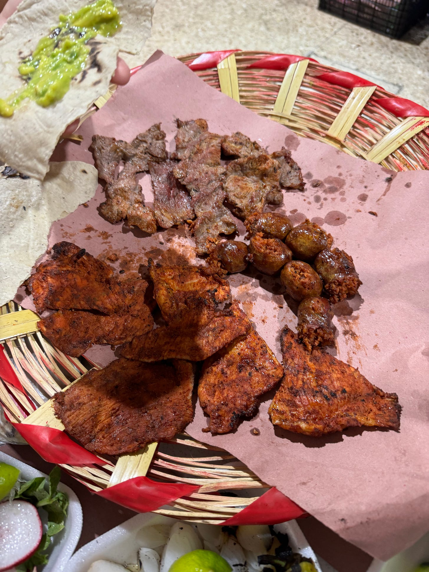 Grilled meat on a plate covered with paper.