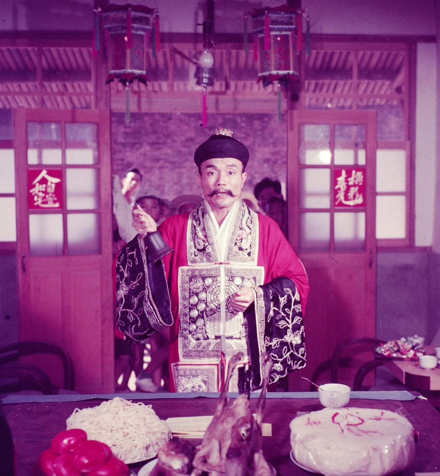 A Daoist priest engrossed in a ceremonial performance in Taiwan, 1954, beautifully captured by photographer Howard Sochurek.