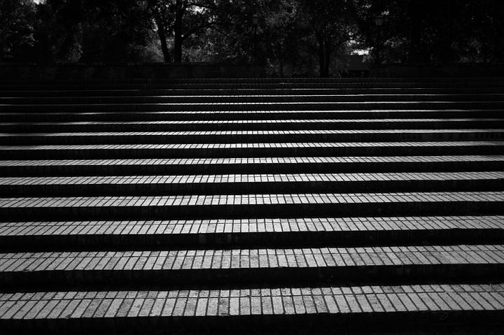 dinosaur skeleton, pendulum, abstract lines on sidewalks