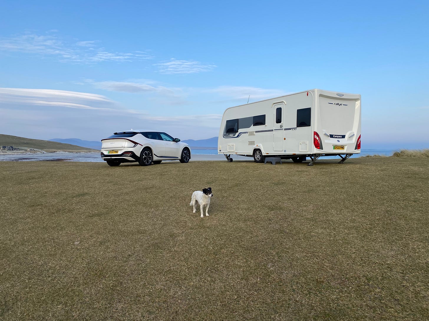 Kia EV6 EV with caravan and dog Andrew Ditton