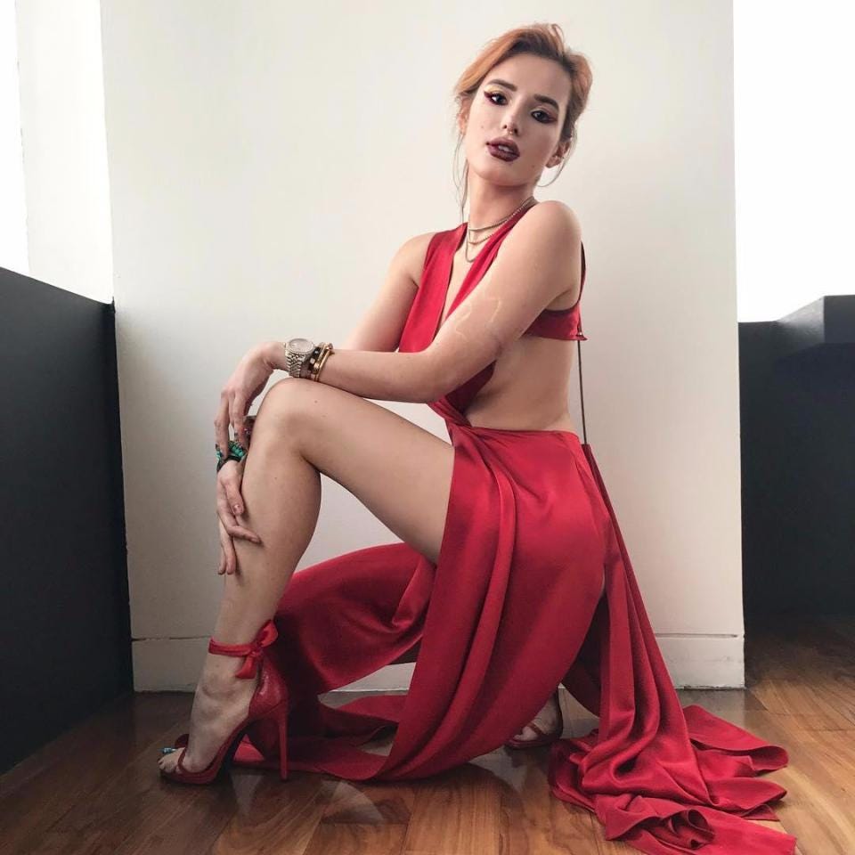 Bella Thorne flashes her long legs and some serious sideboob in sexy red  thigh-split dress on Instagram | The Sun