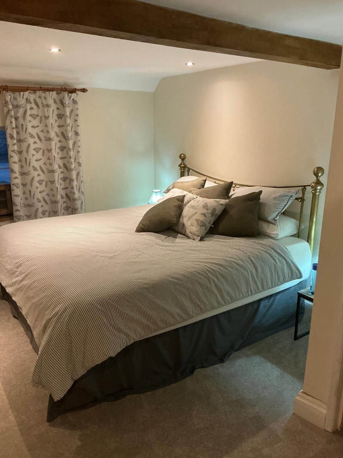 May be an image of bed, bedroom and indoors
