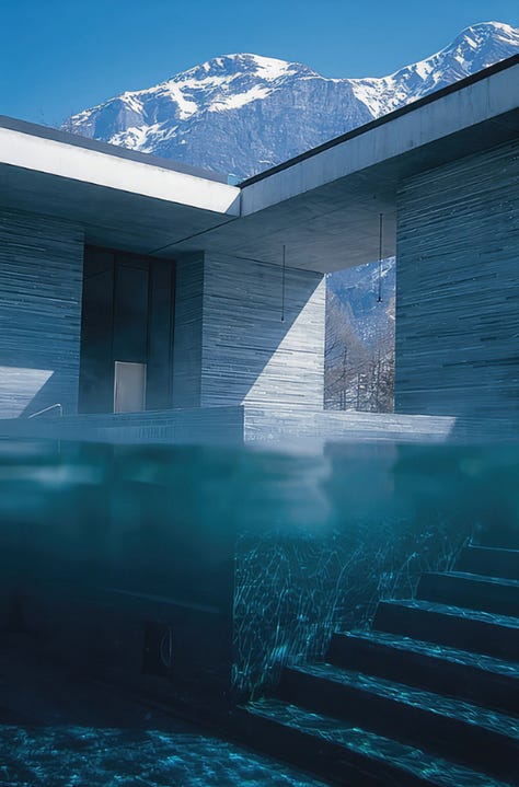 Interior of Therme Vals thermal baths by Peter Zumthor, Vals, Switzerland. Dark quartzite stone walls and thermal water pools lit by natural light from above. Architecture by Peter Zumthor.