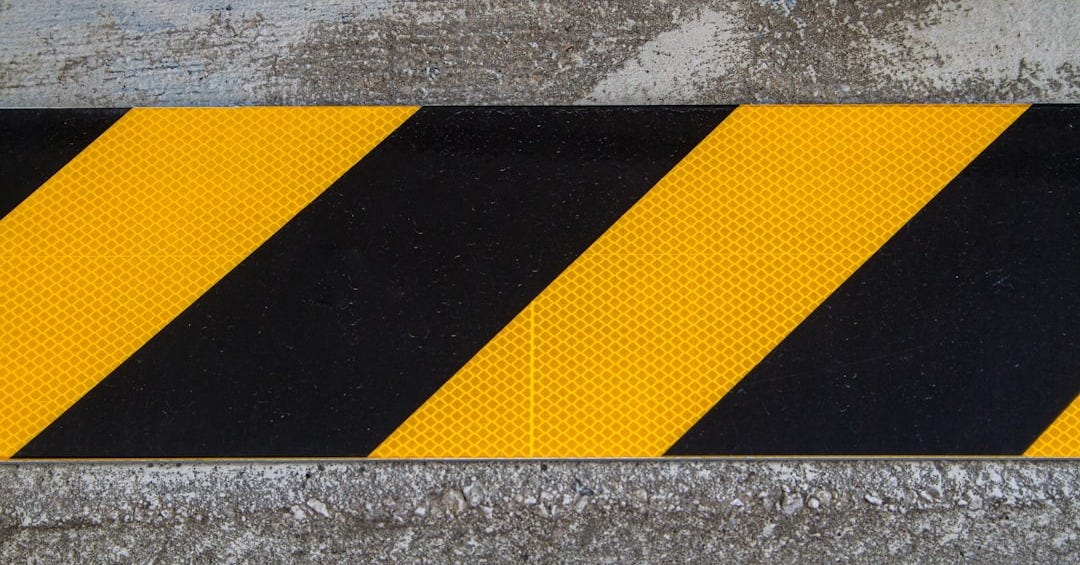 yellow and black striped road sign yellow and black striped road sign