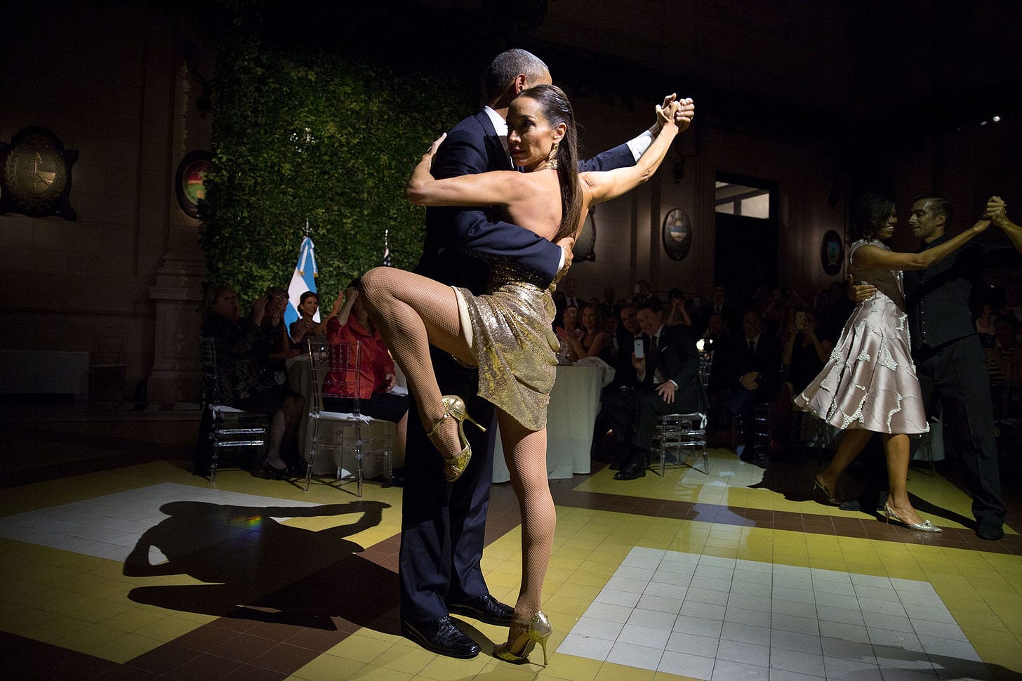 March 23, 2016: President Obama and First Lady Michelle Obama grace the dance floor with renowned tango dancers Mora Godoy and Jose Lugone at a state dinner in Buenos Aires, Argentina. March 23, 2016: President Obama and First Lady Michelle Obama grace the dance floor with renowned tango dancers Mora Godoy and Jose Lugone at a state dinner in Buenos Aires, Argentina.